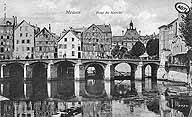 Les moulins vus de l'amont. Carte postale, vers 1900. (AD Seine-et-Marne. 2 Fi 4422)